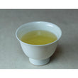 Load image into Gallery viewer, Cup of Kamairicha brewed from naturally grown tea leaves, lightly toasted and smooth flavor
