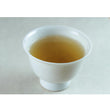Load image into Gallery viewer, Cup of Sannen Bancha brewed from naturally grown Japanese tea leaves, earthy and gently roasted character
